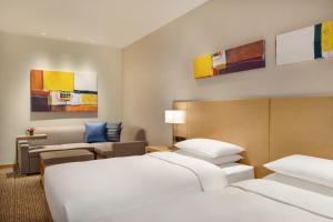 Postel nebo postele na pokoji v ubytování Hyatt Place Beijing Daxing