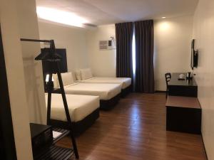 Postel nebo postele na pokoji v ubytování Piña Suites