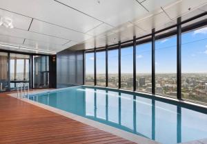 a swimming pool with a view of a city at Lvl 50 Skytower Fabulous Views CBD Wifi Carpark by Stylish Stays in Brisbane