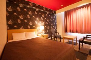 Krevet ili kreveti u jedinici u okviru objekta Quintessa Hotel Iseshima