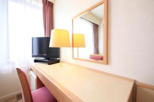 TV i/ili multimedijalni sistem u objektu Quintessa Hotel Iseshima