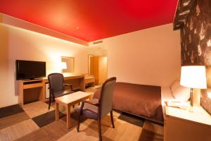 TV i/ili multimedijalni sistem u objektu Quintessa Hotel Iseshima