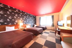 Krevet ili kreveti u jedinici u okviru objekta Quintessa Hotel Iseshima