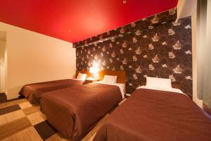 Krevet ili kreveti u jedinici u okviru objekta Quintessa Hotel Iseshima