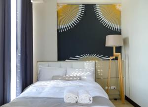 Letto o letti in una camera di C Suites at Mactan Newtown