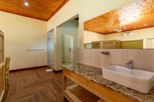 a bathroom with a white sink in a room at Little Pilgrims Boutique Hotel in Hazyview +48 photos
