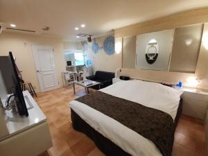 Voodi või voodid majutusasutuse Hotel Allure (Adult Only) toas