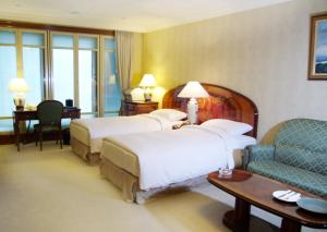 Voodi või voodid majutusasutuse Evergreen Laurel Hotel Taipei toas