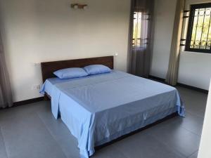 Ένα ή περισσότερα κρεβάτια σε δωμάτιο στο Lacaz Calodyne