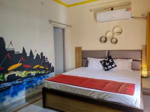 Postel nebo postele na pokoji v ubytování Om Shanthi paying guest house