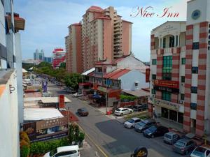 a view of a city with cars parked on a street at Nice Inn in George Town