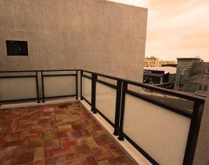 a balcony with a railing and a view of a city at Summer Lotus in Huxi