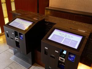 two machines sitting next to each other on a counter at Hotel Keihan Tokyo Yotsuya in Tokyo