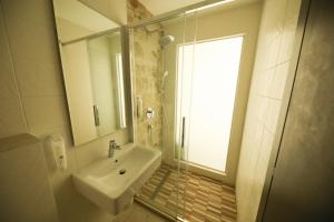 Koupelna v ubytování Hotel Delfin