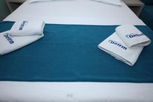 Postel nebo postele na pokoji v ubytování Hotel Delfin