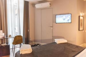 A bed or beds in a room at Relais Della Porta