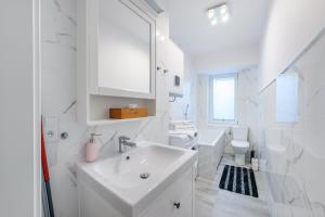 Kúpeľňa v ubytovaní Apartament przy Bulwarze + 16 fotografií