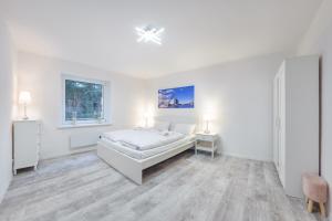 Posteľ alebo postele v izbe v ubytovaní Apartament przy Bulwarze