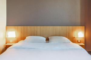 Postel nebo postele na pokoji v ubytování B&B HOTEL Toulon Ollioules
