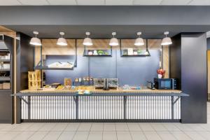 a kitchen with a counter top in a room at B&B HOTEL Lille Centre Grand Palais in Lille