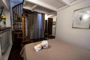 Un pat sau paturi într-o cameră la Residence Garibaldi