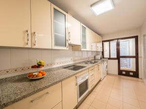 A kitchen or kitchenette at MALAGA CENTER EXPERIENCE - Premium Apartment