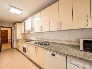 A kitchen or kitchenette at MALAGA CENTER EXPERIENCE - Premium Apartment