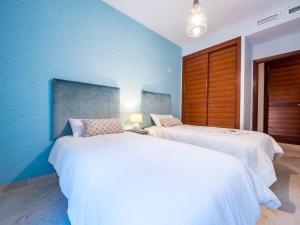 A bed or beds in a room at MALAGA CENTER EXPERIENCE - Premium Apartment