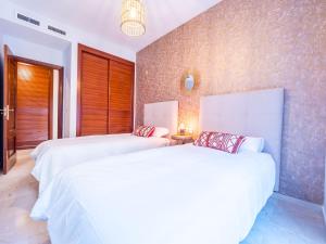 A bed or beds in a room at MALAGA CENTER EXPERIENCE - Premium Apartment
