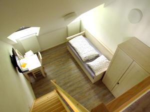 Кровать или кровати в номере Rodinný hotel Pod Bílou skálou