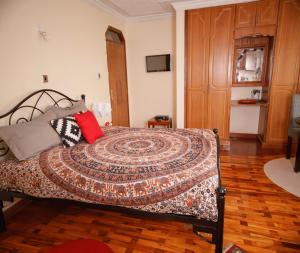 Postel nebo postele na pokoji v ubytování Sherry Homes - Kwetu