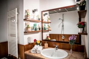 a bathroom with a sink and a mirror at Airguest Crocetta loft in Milan