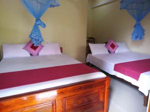 Katil atau katil-katil dalam bilik di Udesh Guest