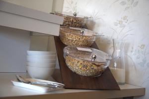 a shelf with three bowls of food on it at Villa zur schönen Aussicht in Bad Salzuflen +65 photos