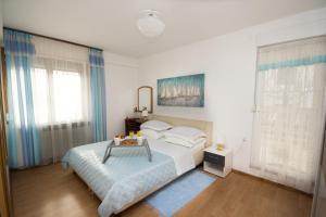 Postel nebo postele na pokoji v ubytování Apartments Leo