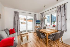Televízia a/alebo spoločenská miestnosť v ubytovaní Appartement - das kleine Bleiberger by Schladmingurlaub