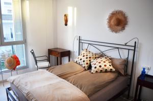 a bed with pillows on it in a bedroom at Casa Andersen in Port de Pollensa +12 photos
