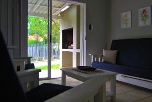 a living room with a couch and a table at Aloe Ridge in Mossel Bay