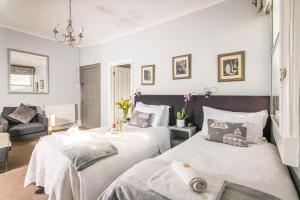 Cama o camas de una habitación en The Henry Guest House
