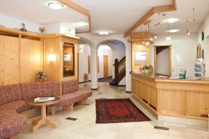 a lobby with a couch and a counter in a store at Hotel garni Kappeler-Haus in Oberstdorf