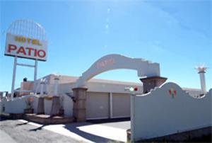 a motel with a sign and a motelato sign at Hotel Patio Ise (Adult Only) in Ise