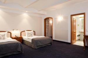Voodi või voodid majutusasutuse Gildors Hotel Atmosphère toas