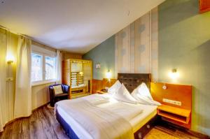 Postel nebo postele na pokoji v ubytování Hotel Jakob