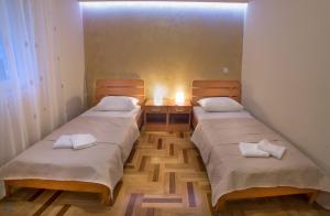 Postel nebo postele na pokoji v ubytování Apartments Vila Marija