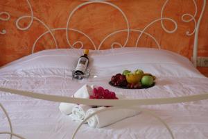 A bed or beds in a room at Ventoura Studios & Apartments