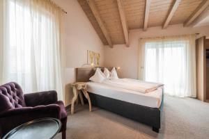Posteľ alebo postele v izbe v ubytovaní Boutiquehotel Minigolf