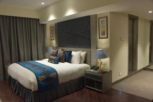 Voodi või voodid majutusasutuse Marina- Shimla First Designer Boutique Hotel toas