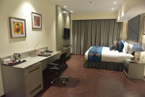 Voodi või voodid majutusasutuse Marina- Shimla First Designer Boutique Hotel toas