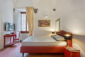 A bed or beds in a room at Residenza d'Epoca Galleria dell'Accademia