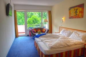 Postel nebo postele na pokoji v ubytování Hotel Excelsior + 17 fotografií